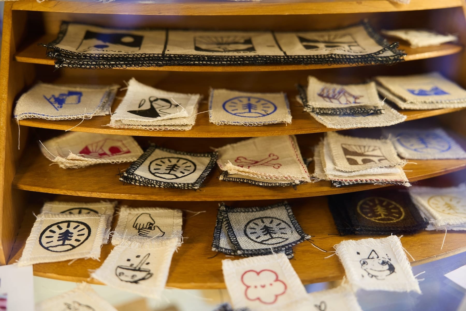 A selection of printed cloth patches in the One Tree shop.