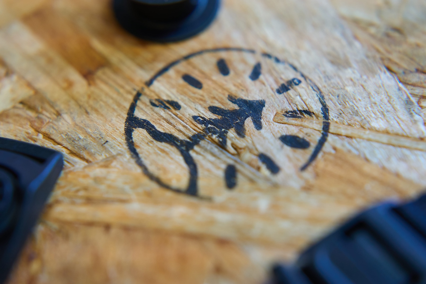 The One Tree logo stamped onto one of our work benches