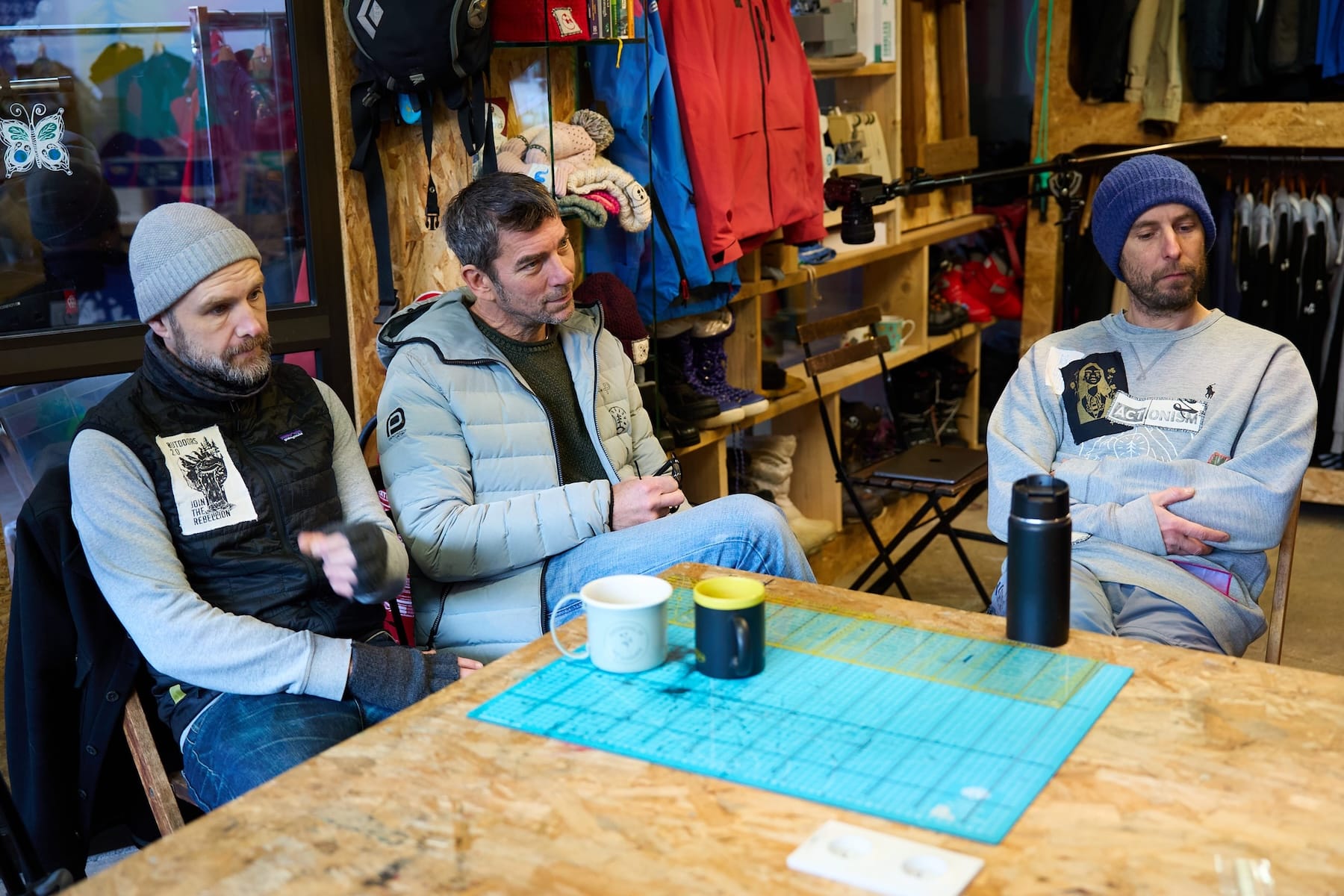 Gav, Stu and Andy listen intently during a talk about adaptive ski clothing for para-skiers
