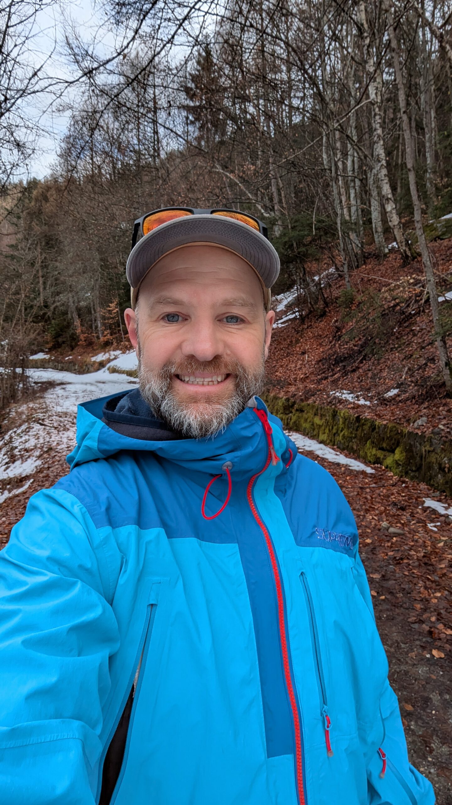 Andy smiling on a footpath in a Made to be Worn jacket